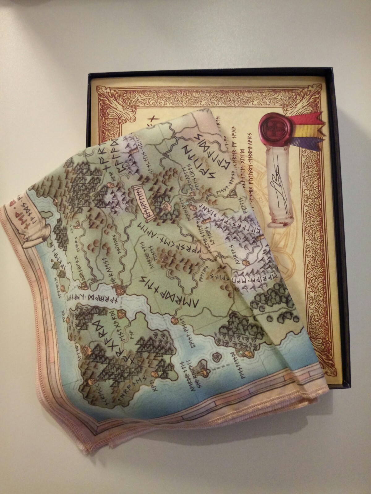 Opened game box, with map visible inside